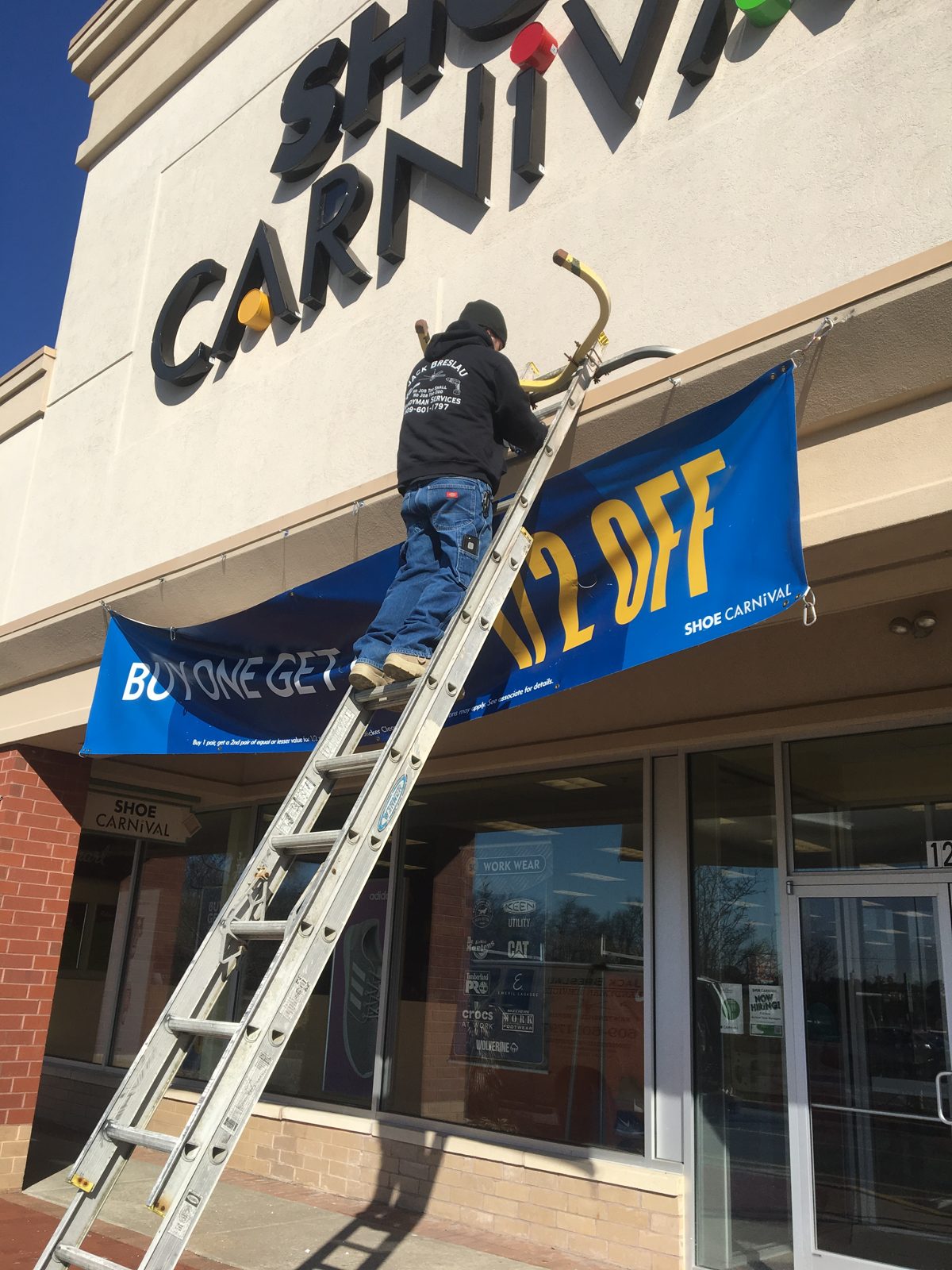 Storefront sign install
