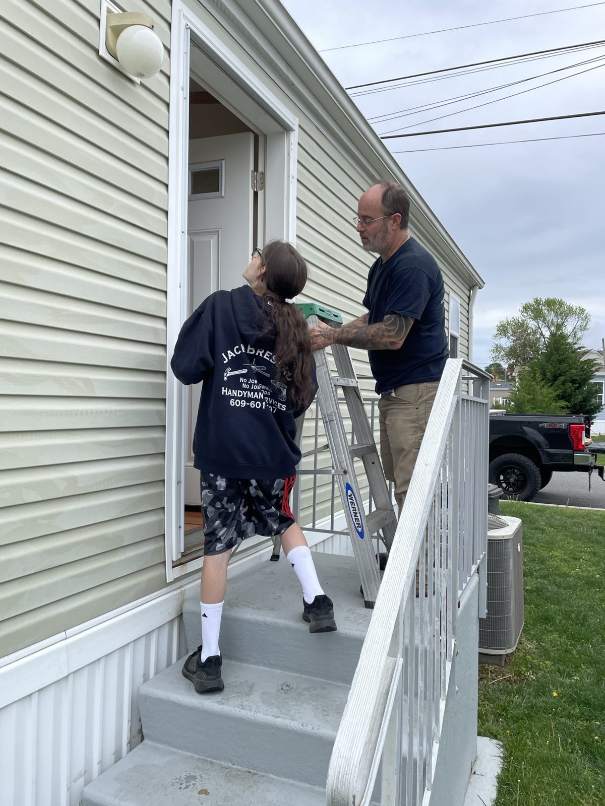 A young helper on a door install